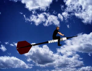 Man riding a dart through the sky - Leadership and sense of purpose concept